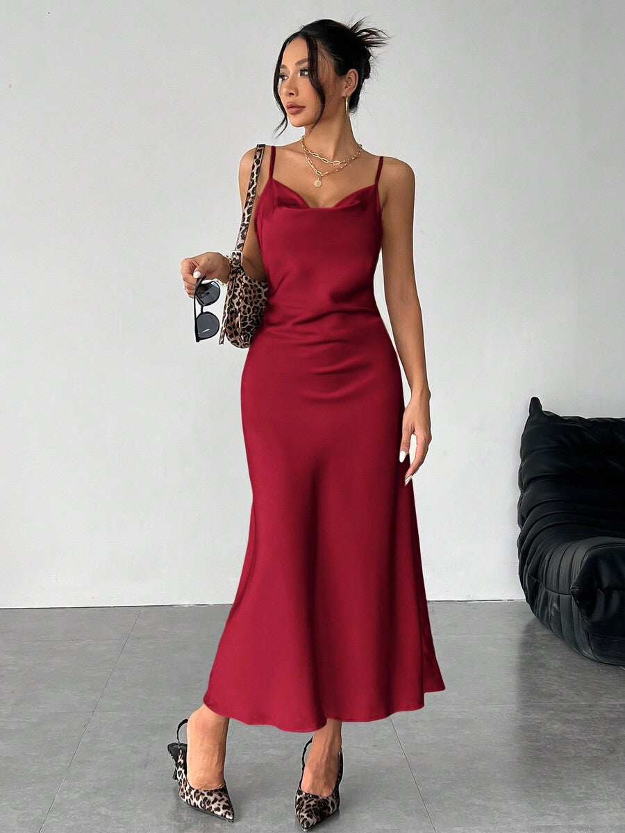 Women's long apricot satin cami dress featuring a draped swing collar, spaghetti straps, backless zipper back, and mermaid hem.