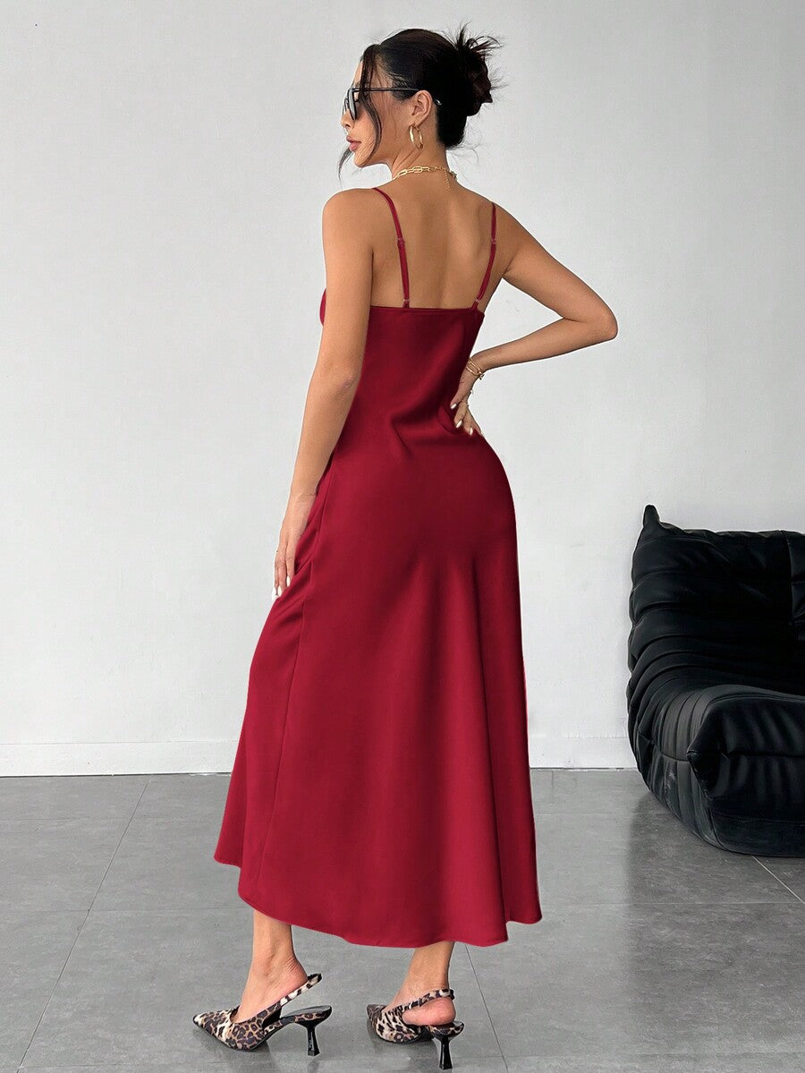Women's long apricot satin cami dress featuring a draped swing collar, spaghetti straps, backless zipper back, and mermaid hem.