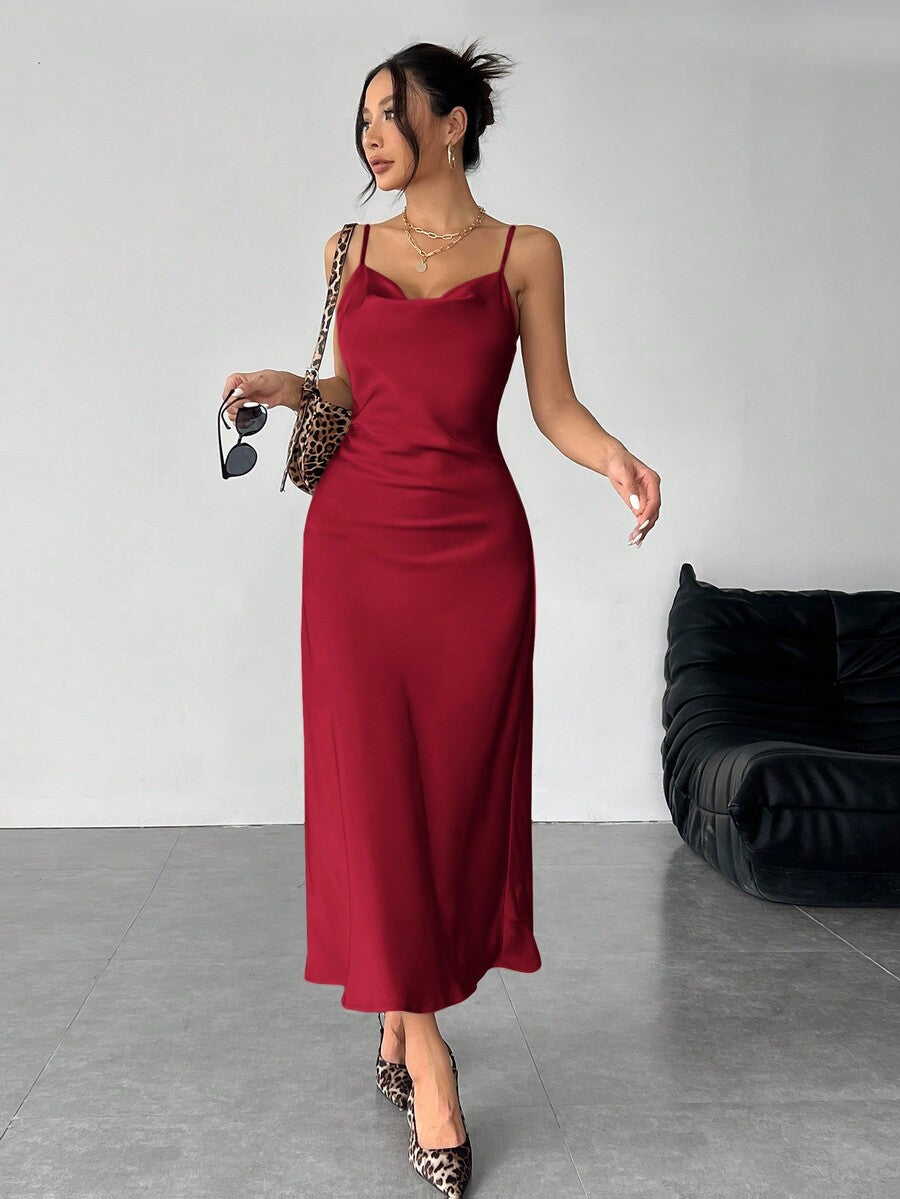 Women's long apricot satin cami dress featuring a draped swing collar, spaghetti straps, backless zipper back, and mermaid hem.