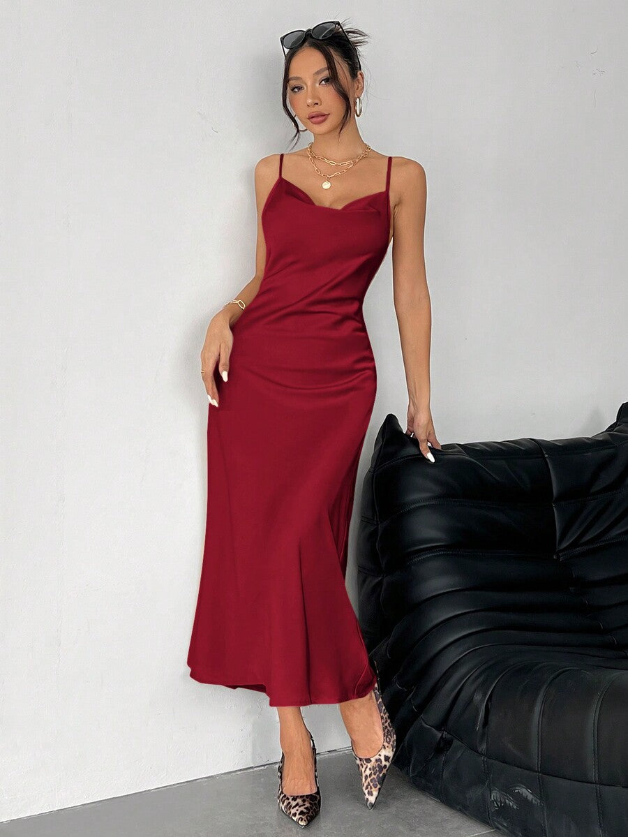 Women's long apricot satin cami dress featuring a draped swing collar, spaghetti straps, backless zipper back, and mermaid hem.