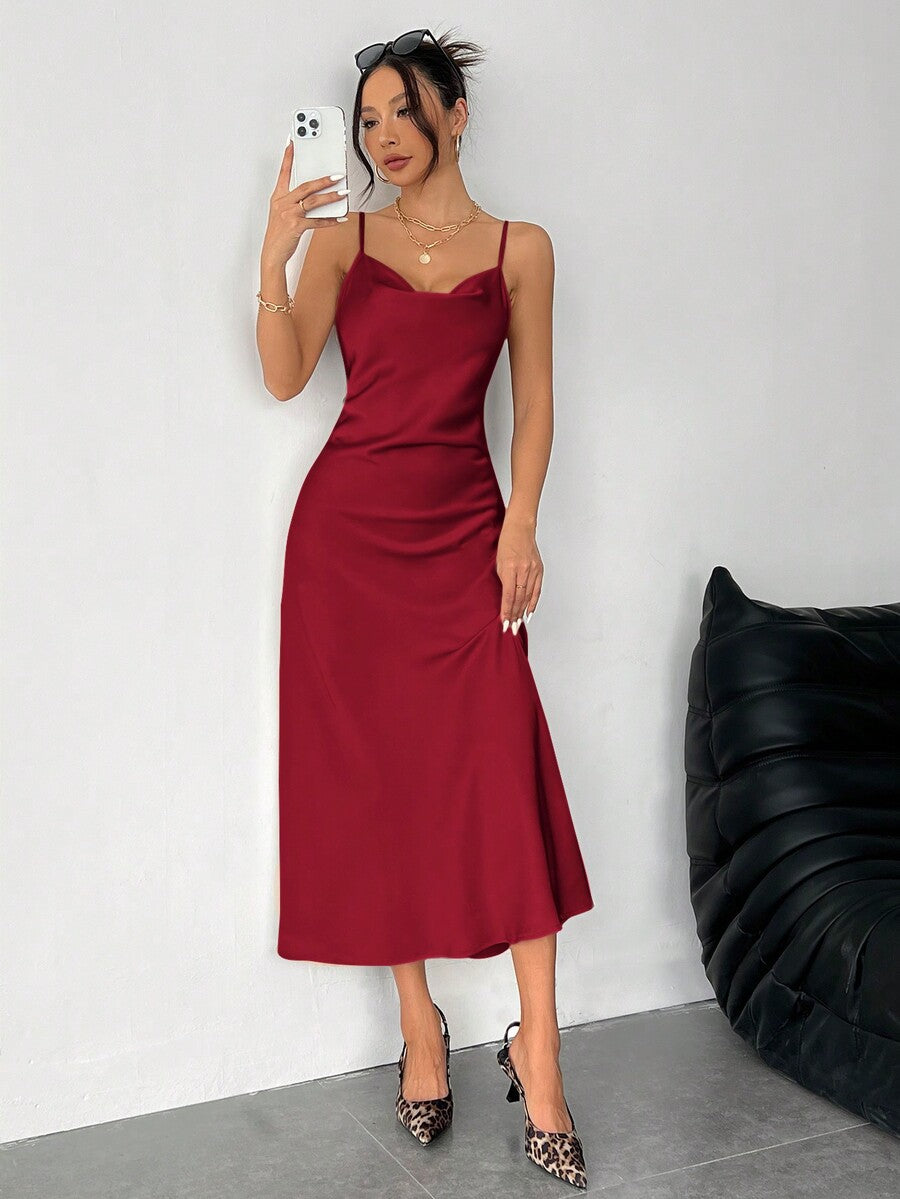 Women's long apricot satin cami dress featuring a draped swing collar, spaghetti straps, backless zipper back, and mermaid hem.
