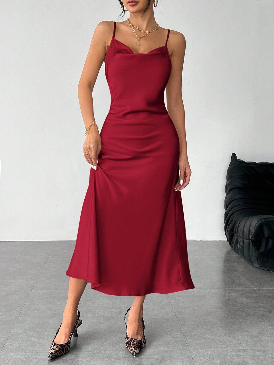 Women's long apricot satin cami dress featuring a draped swing collar, spaghetti straps, backless zipper back, and mermaid hem.