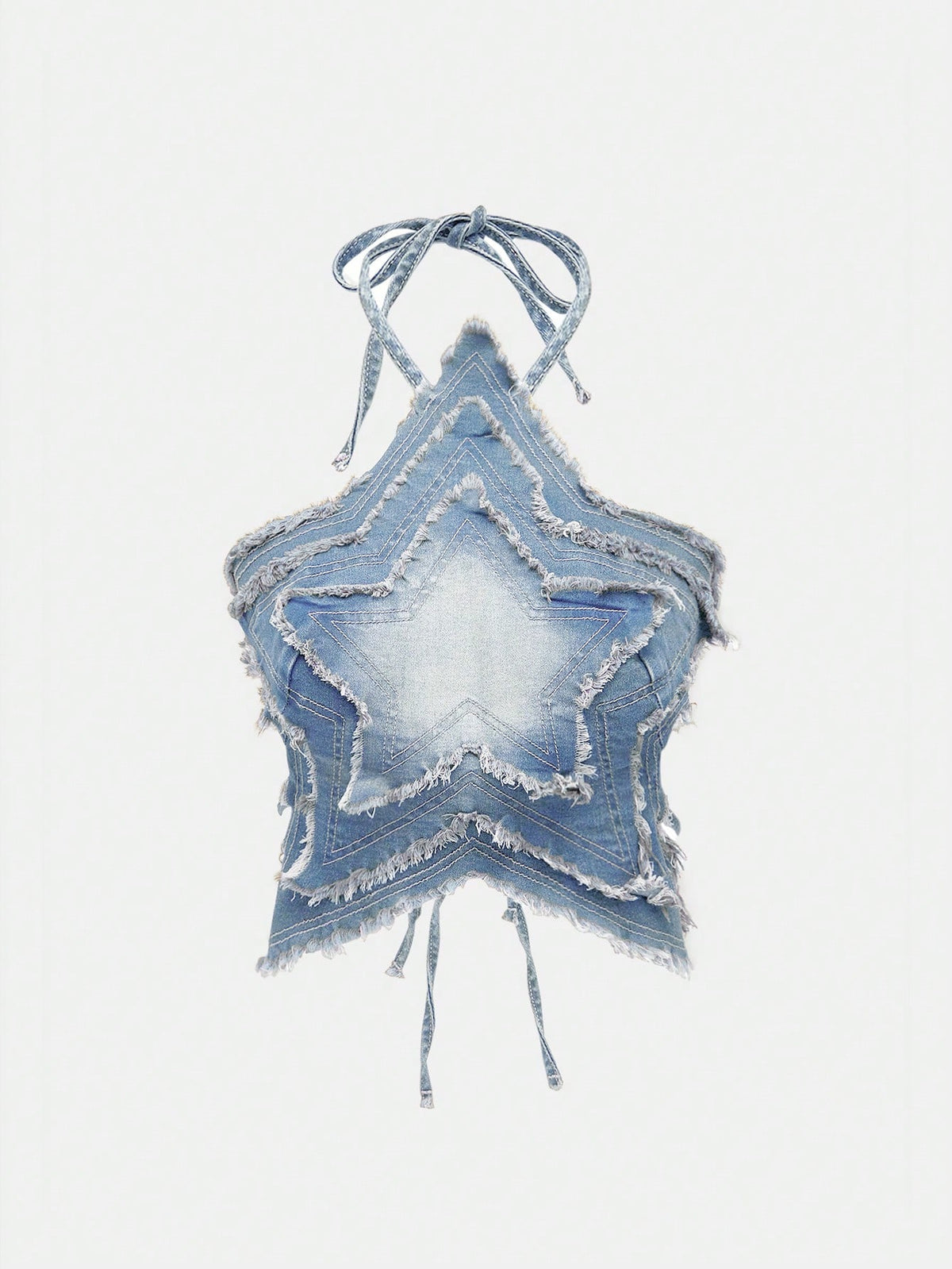Blue denim halter tank top for women featuring distressed star patch detail, asymmetrical crop hem, and backless tie-back design.