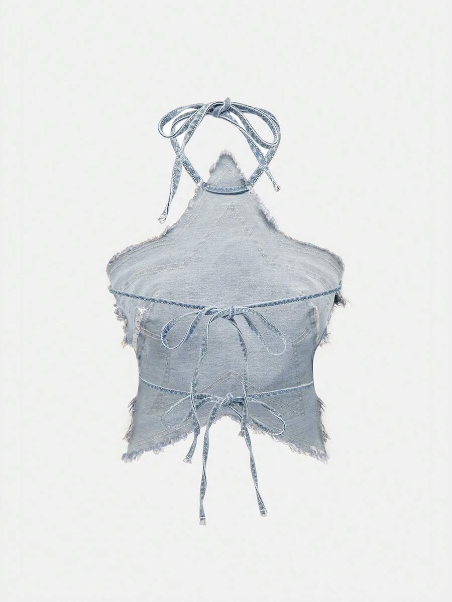 Blue denim halter tank top for women featuring distressed star patch detail, asymmetrical crop hem, and backless tie-back design.