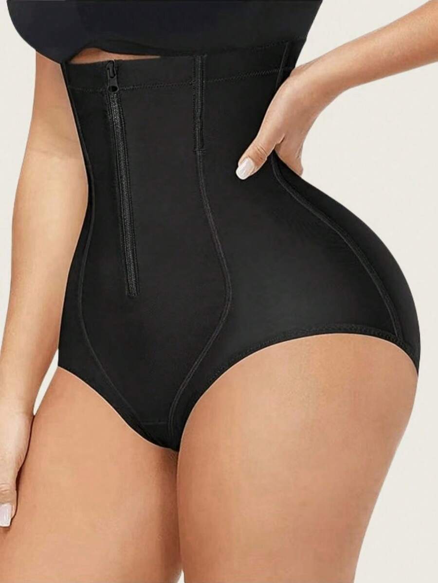 Women's black super high waist shaping pants with zipper closure, strong tummy control, and butt lifting feature.