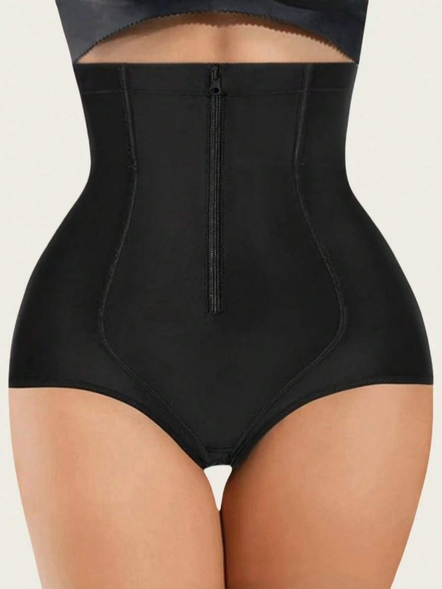 Women's black super high waist shaping pants with zipper closure, strong tummy control, and butt lifting feature.
