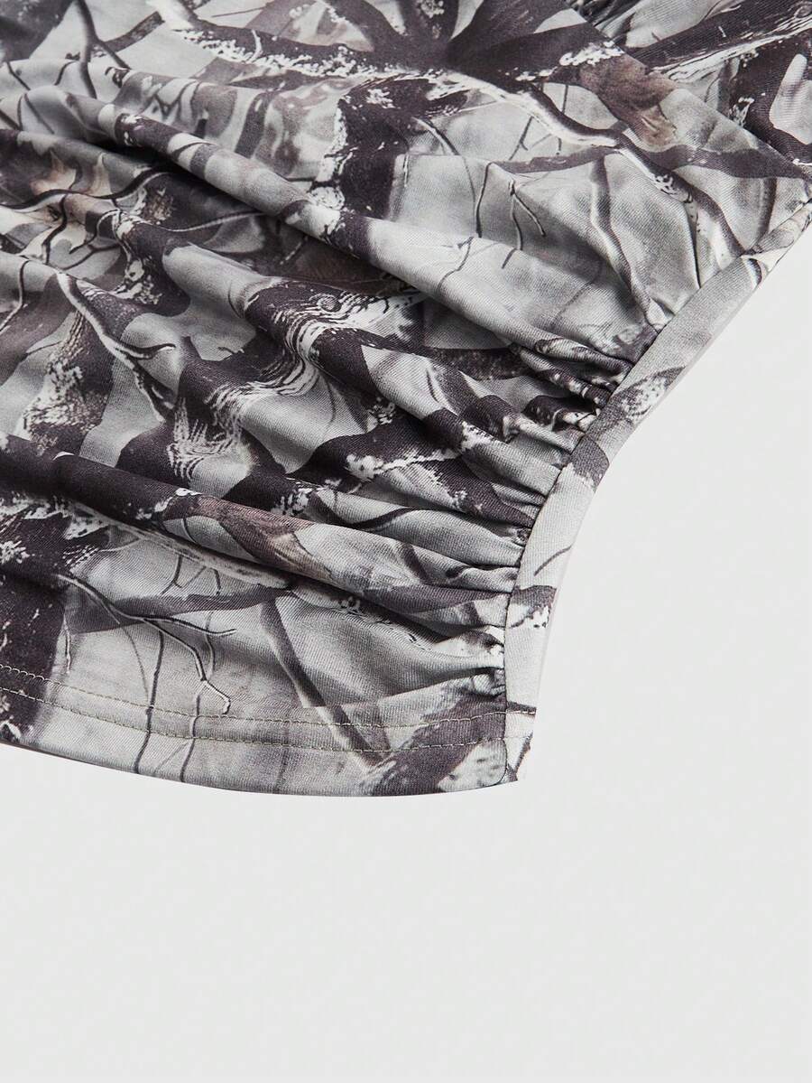 Women's slim fit camo crop tank top styled with contrast lace trim, front bow accent, and matching arm sleeves.