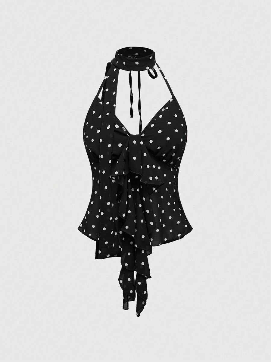 Black halter crop top featuring an asymmetrical ruffle hem and backless design for women.