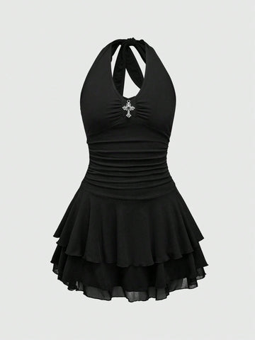 Front view of women's black sleeveless halter mini dress featuring a backless slim fit silhouette and tiered ruffle hem.