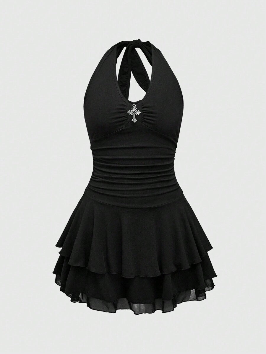 Front view of women's black sleeveless halter mini dress featuring a backless slim fit silhouette and tiered ruffle hem.
