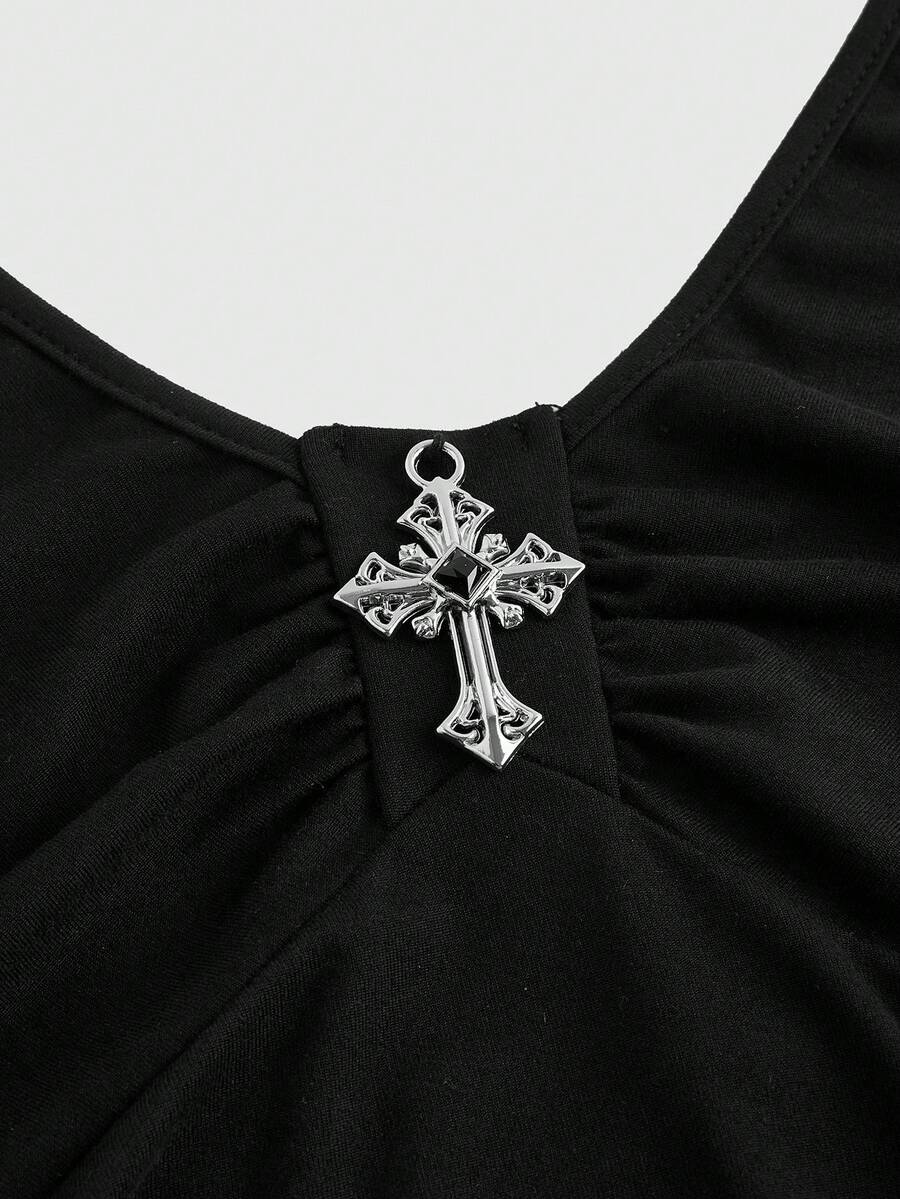 Front view of women's black sleeveless halter mini dress featuring a backless slim fit silhouette and tiered ruffle hem.