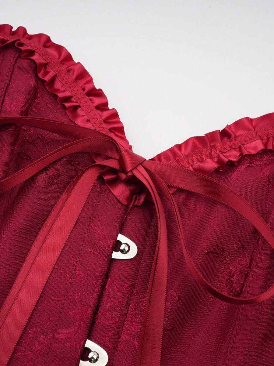Women’s strapless corset bustier top with front button detail, lace-up back, frill accents, slim fit, and asymmetrical hem.