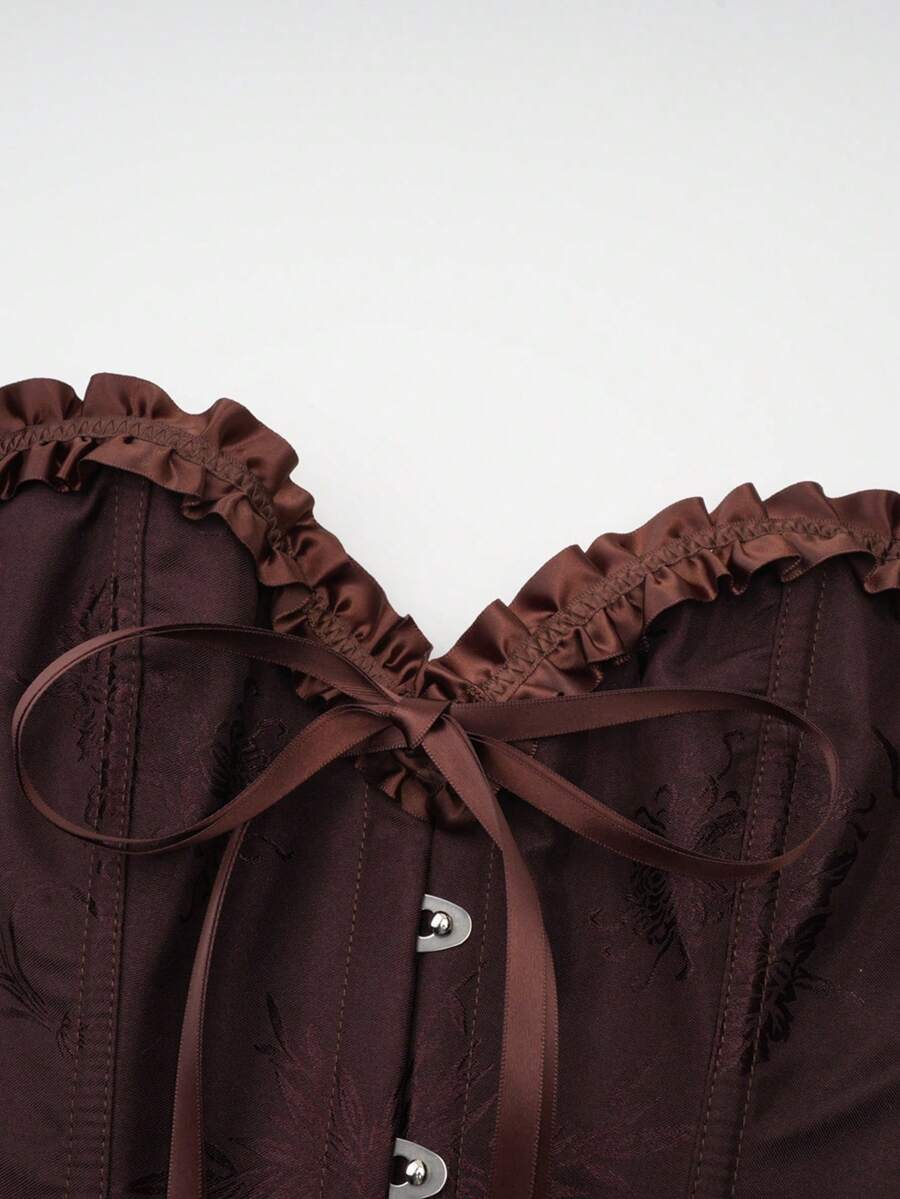 Women’s strapless corset bustier top with front button detail, lace-up back, frill accents, slim fit, and asymmetrical hem.