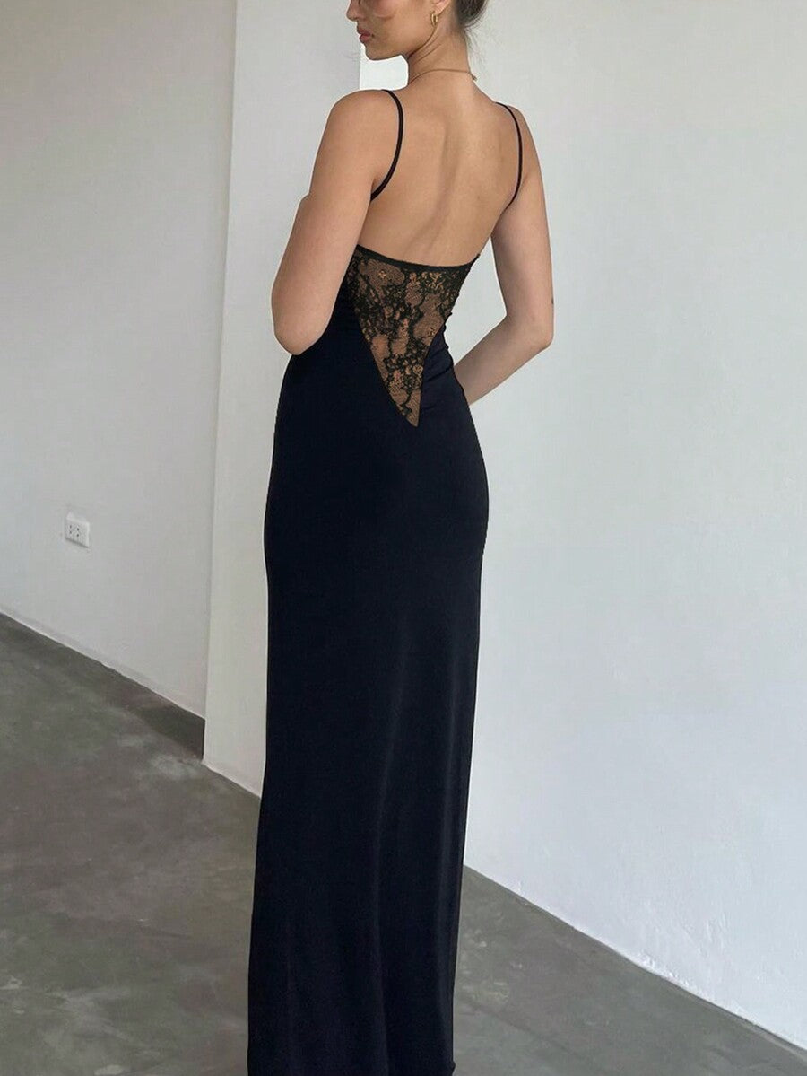 Women's black backless midi cami dress with spaghetti straps, contrast mesh details, and a high thigh slit.