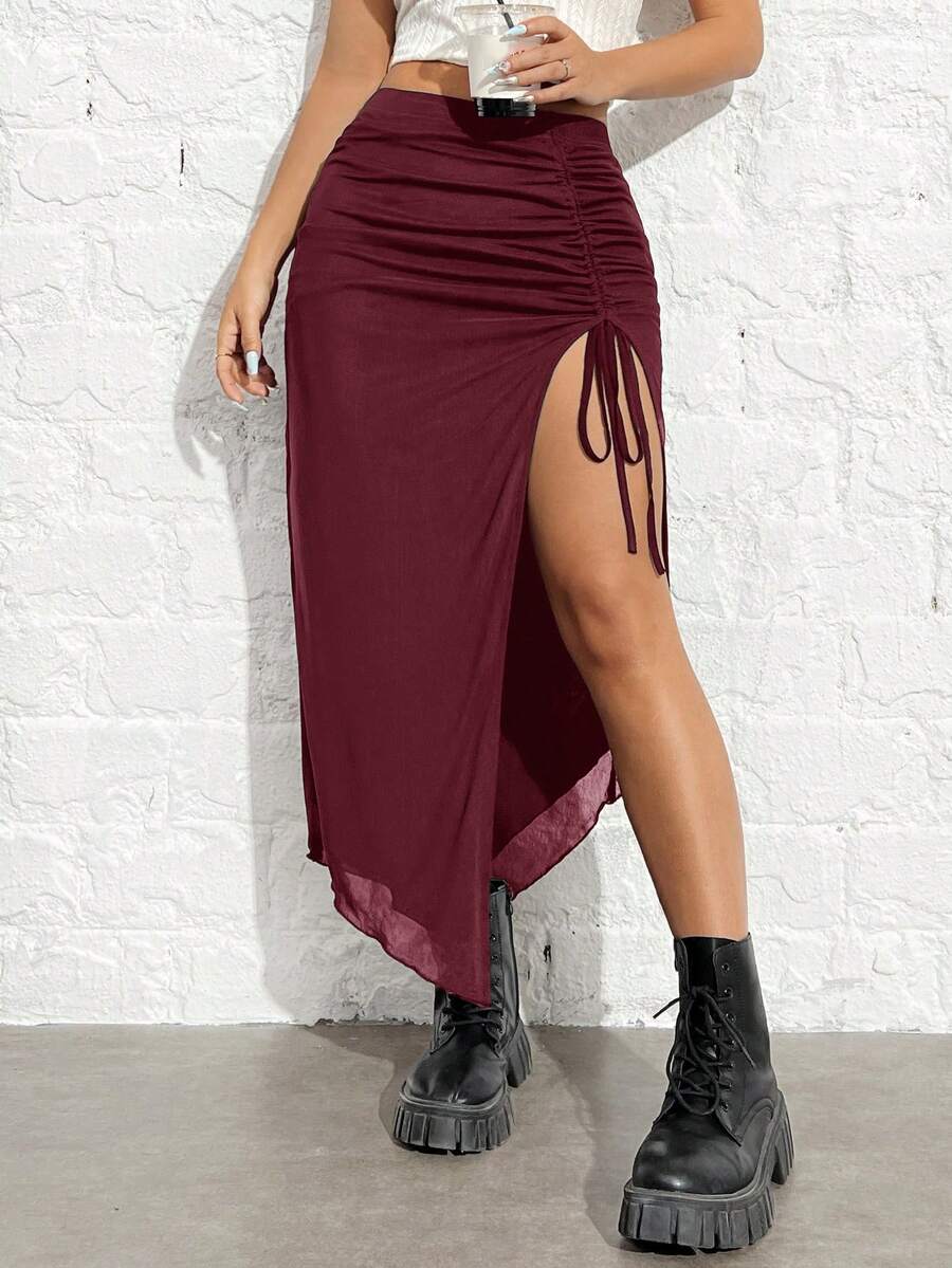 Women's black high-waisted bodycon long skirt featuring a drawstring split thigh detail and mesh fabric.