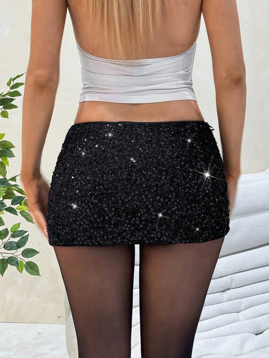 Women's black sequin bodycon mini skirt with low waist and zipper detail for party night out