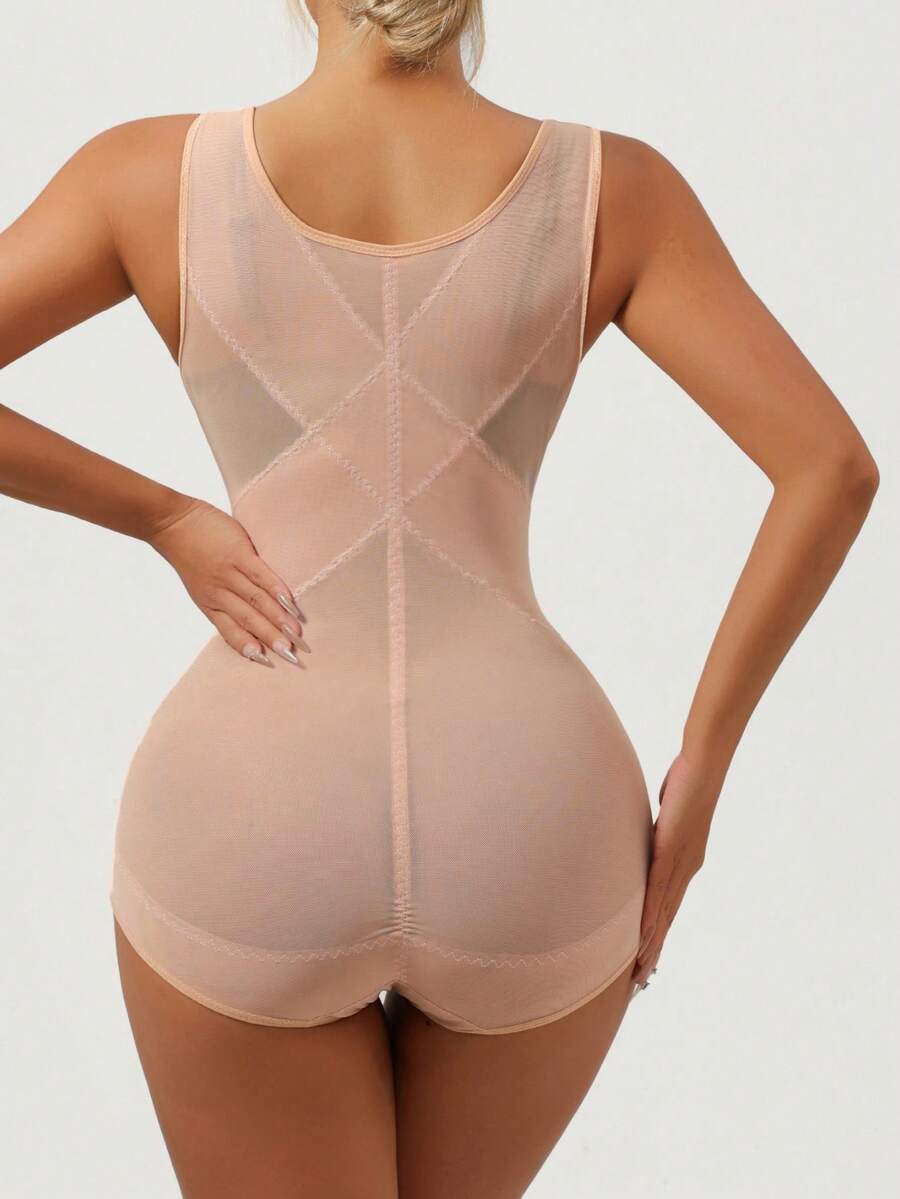 Apricot semi-sheer mesh shapewear bodysuit for women featuring a low-cut neckline, bust support, contrast mesh details, and Bermuda shorts length.