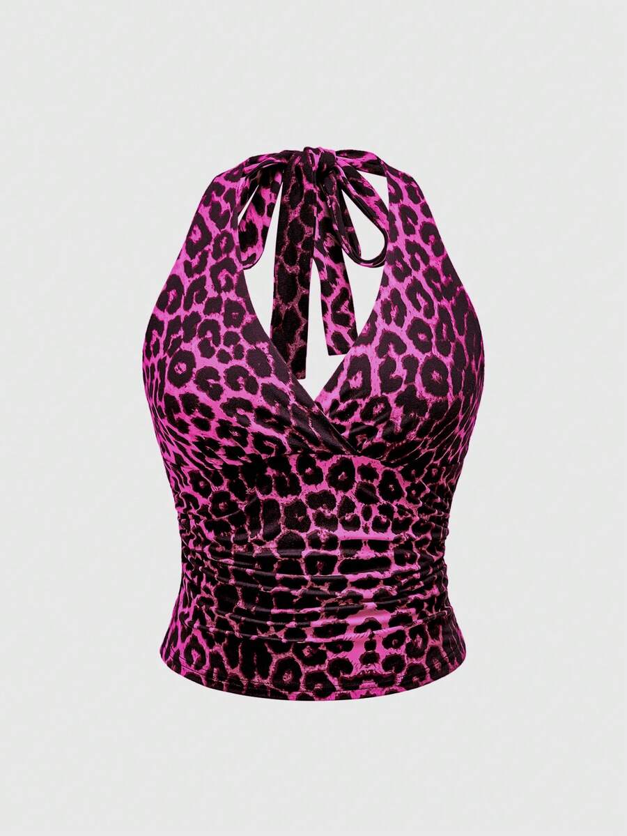 Women's halter crop tank top featuring a backless silhouette and ruched detailing in a slim fit design.