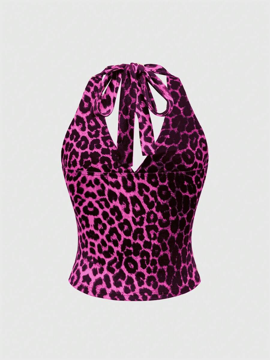 Women's halter crop tank top featuring a backless silhouette and ruched detailing in a slim fit design.