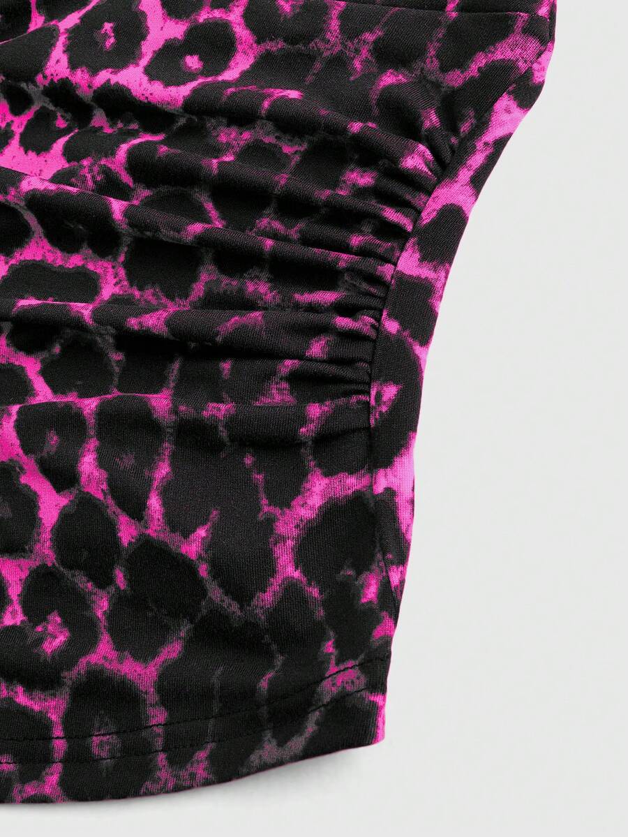 Women's halter crop tank top featuring a backless silhouette and ruched detailing in a slim fit design.