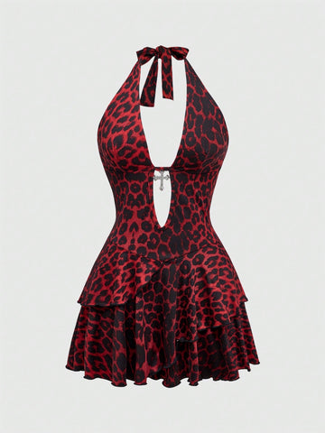Women's burgundy halter leopard print mini dress featuring a backless cut-out design and tiered layered hem.