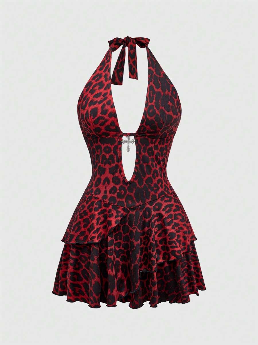Women's burgundy halter leopard print mini dress featuring a backless cut-out design and tiered layered hem.