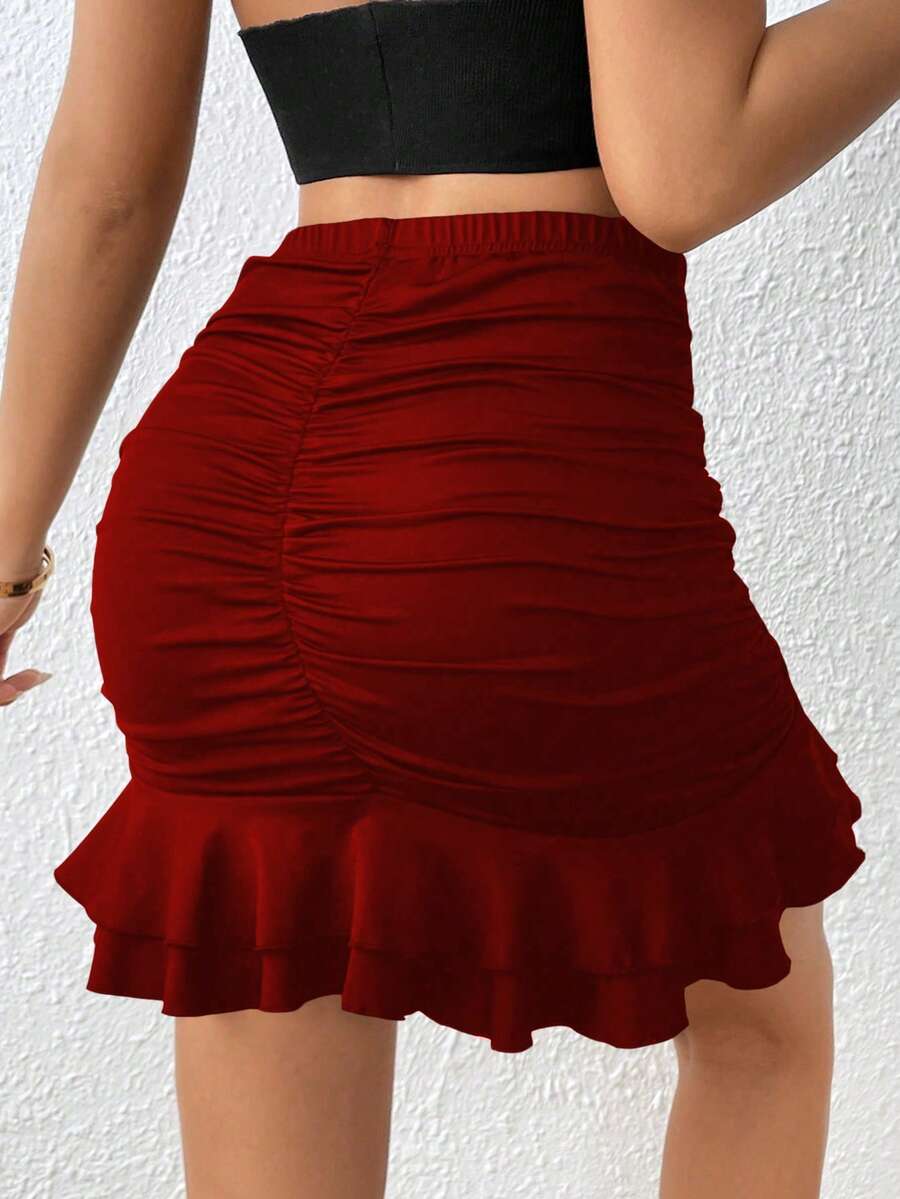 Black high waist ruched bodycon mini skirt featuring a tiered ruffle hem and skinny casual fit for women.