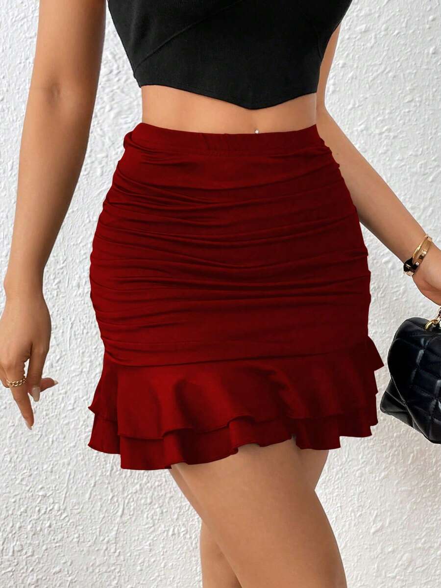 Black high waist ruched bodycon mini skirt featuring a tiered ruffle hem and skinny casual fit for women.