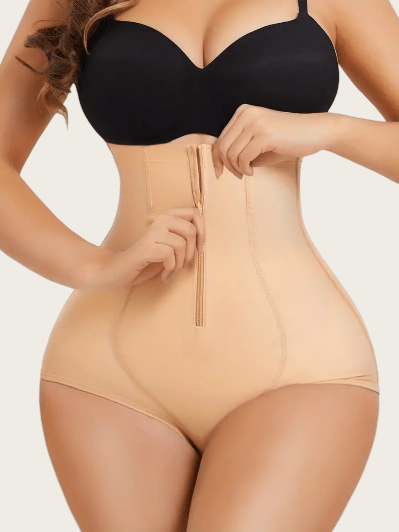 Women's black super high waist shaping pants with zipper closure, strong tummy control, and butt lifting feature.