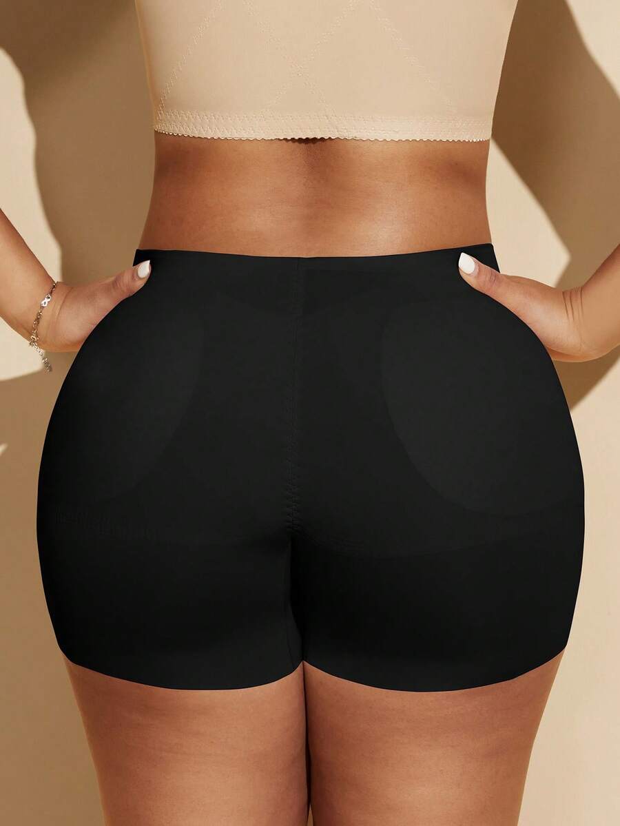 Women's black seamless waist trainer shorts featuring tummy control and butt lifting pads