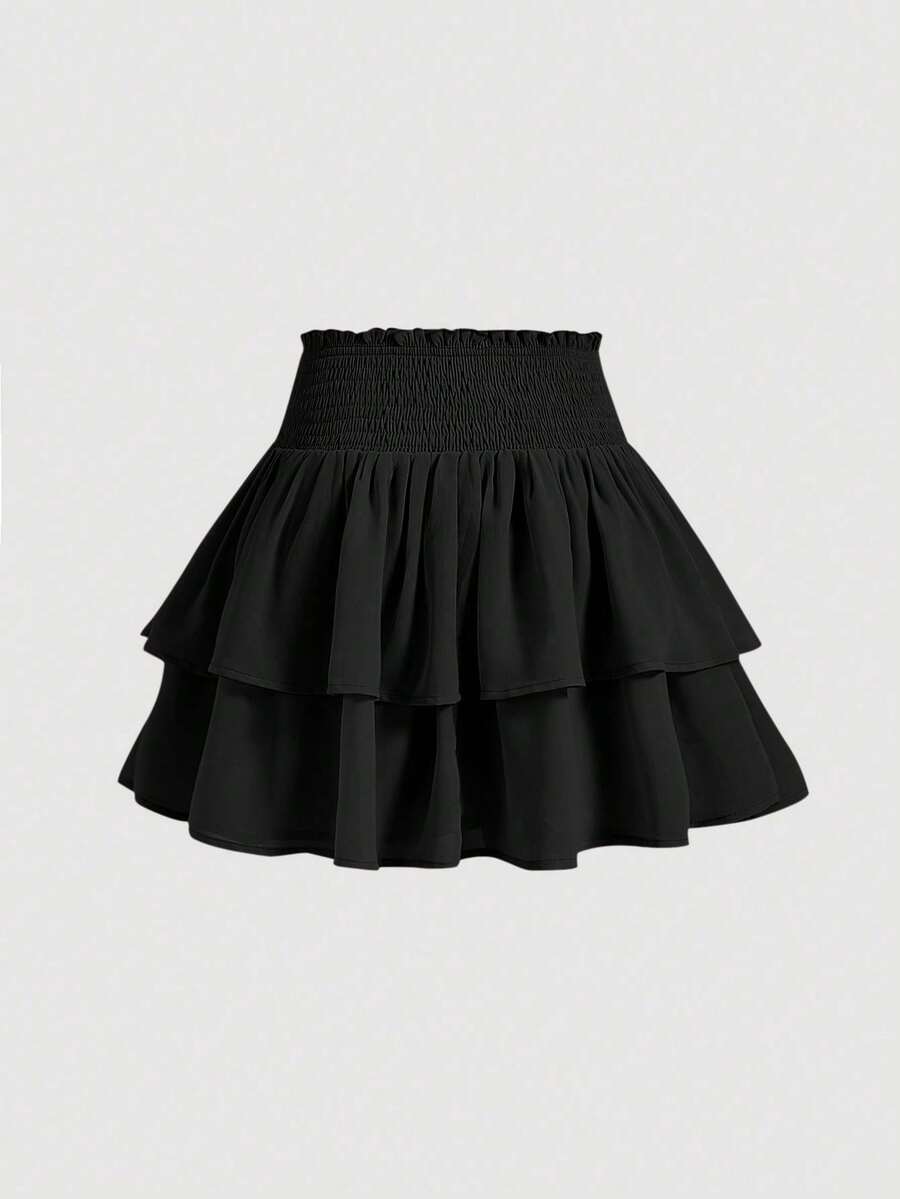 Women's high waist tiered ruffle layered mini skort in black featuring shirred details and ruffle hem.