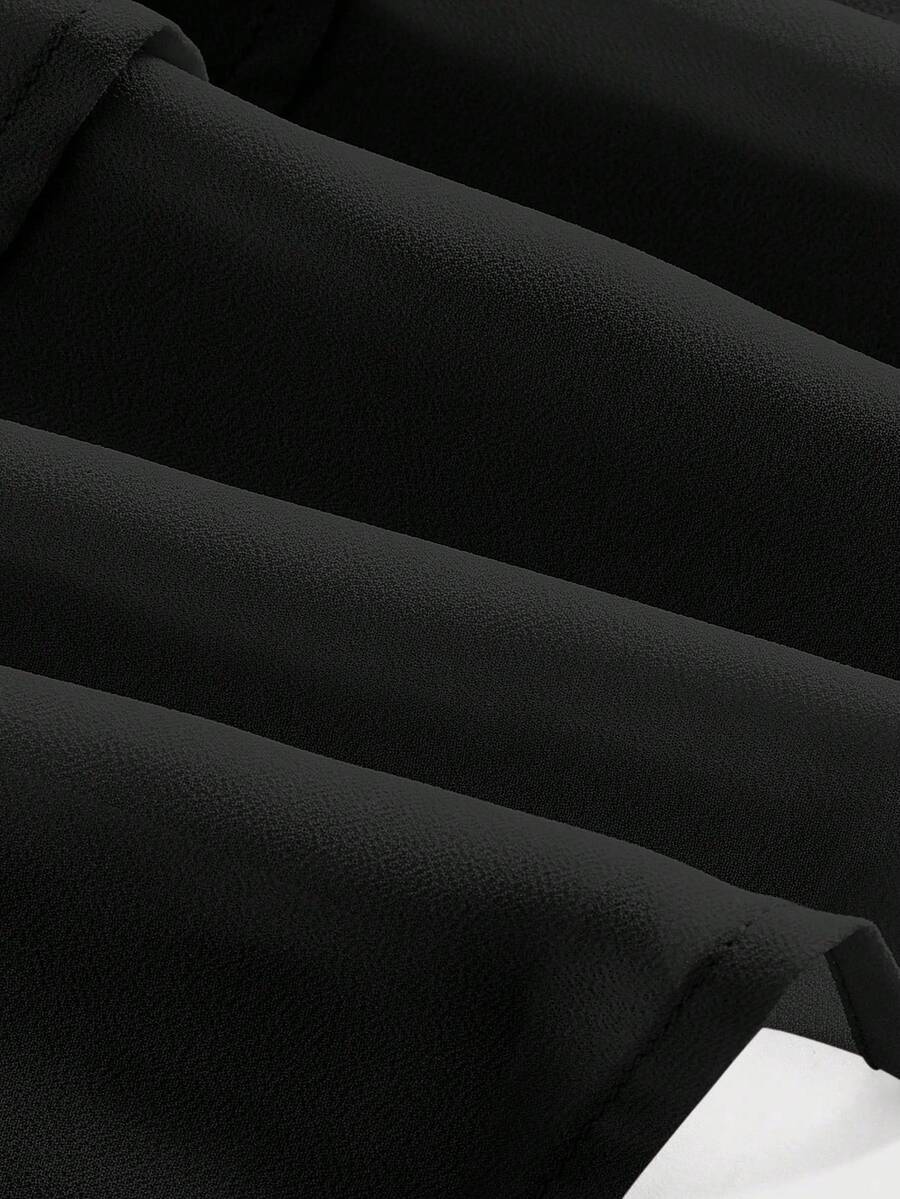 Women's high waist tiered ruffle layered mini skort in black featuring shirred details and ruffle hem.