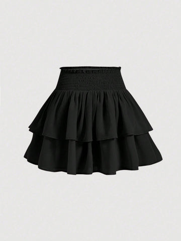 Women's high waist tiered ruffle layered mini skort in black featuring shirred details and ruffle hem.