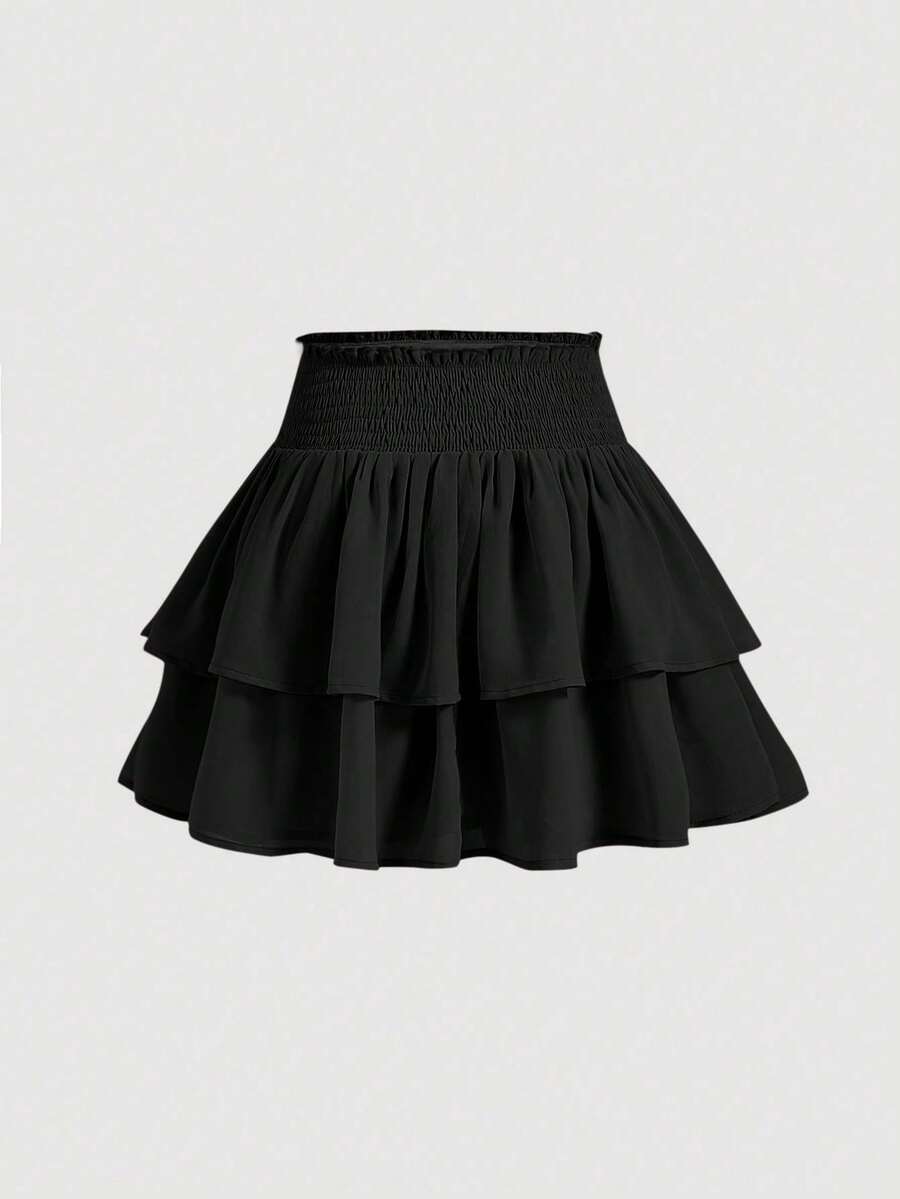 Women's high waist tiered ruffle layered mini skort in black featuring shirred details and ruffle hem.