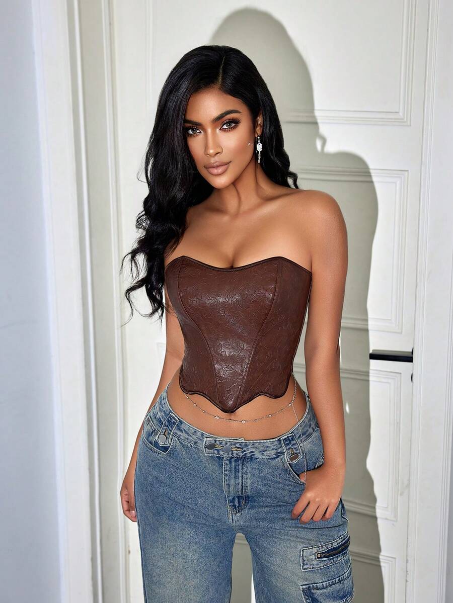 Brown vintage floral textured PU leather bustier crop top for women featuring a strapless backless design, steel boning, asymmetrical hem, and lace-up back detail.