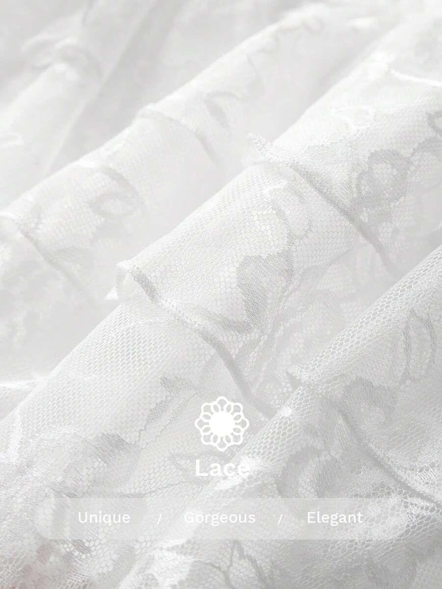 Women's white lace tiered mini skort featuring a low waist, ruffle hem, contrast lace detail, and lined stretch fabric.