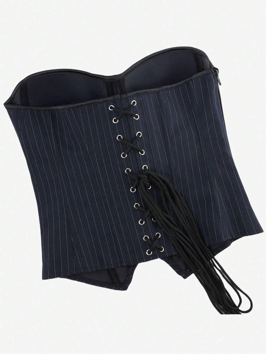 Black overbust corset top with strapless design, boned support, tie-back and zipper closure for women shapewear styling.