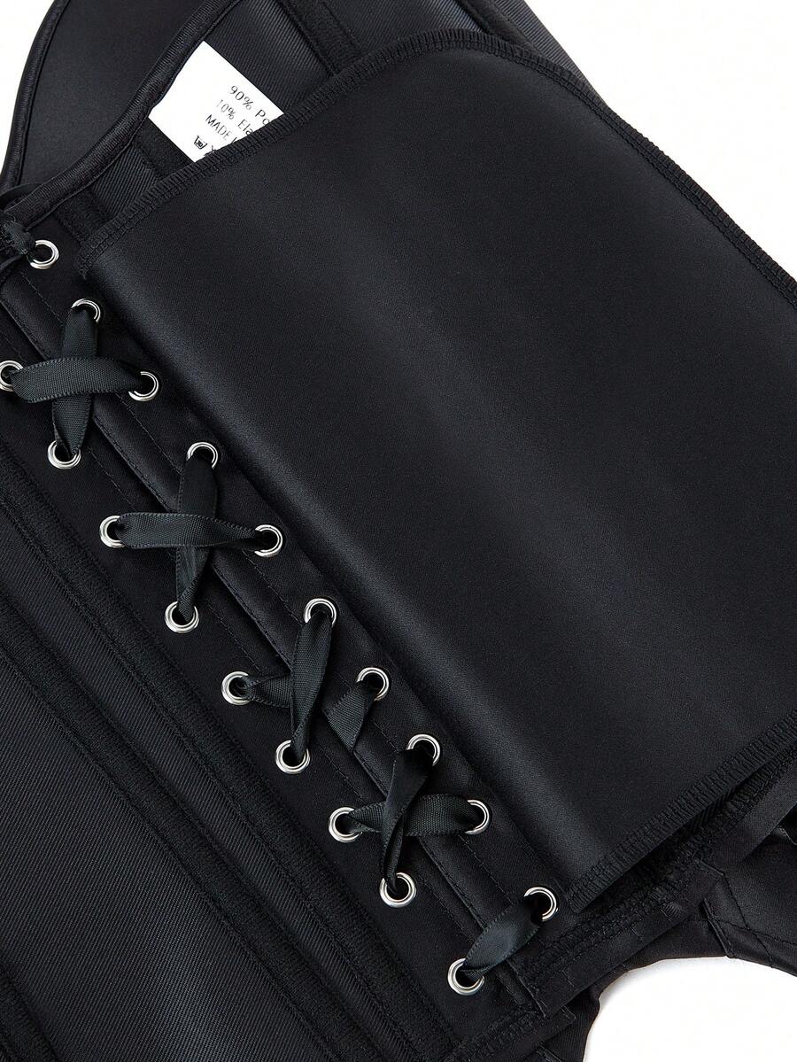 Black overbust corset top with strapless design, boned support, tie-back and zipper closure for women shapewear styling.
