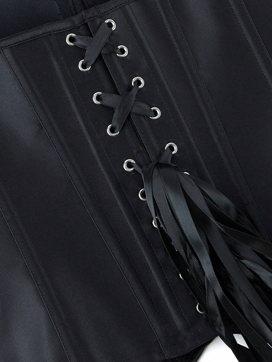 Black overbust corset top with strapless design, boned support, tie-back and zipper closure for women shapewear styling.