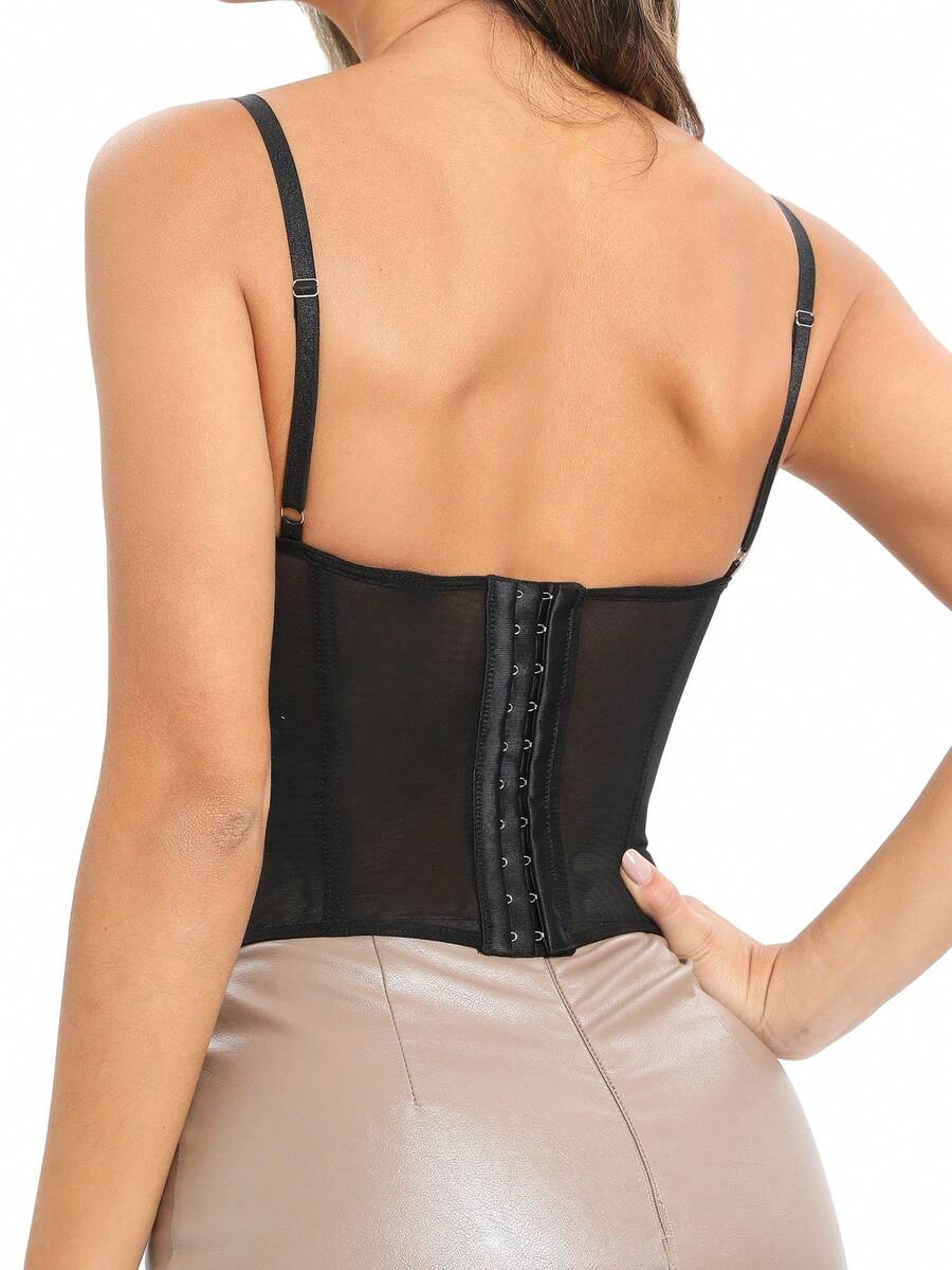 Black lace bustier corset top for women with buckle detail, spaghetti straps, slim fit, and lightweight mesh fabric for a night out look.