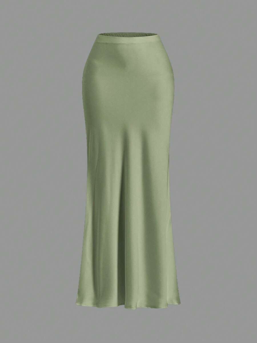 Women's black woven mermaid maxi skirt featuring a solid color design, mid waist, and 100% cotton fabric.