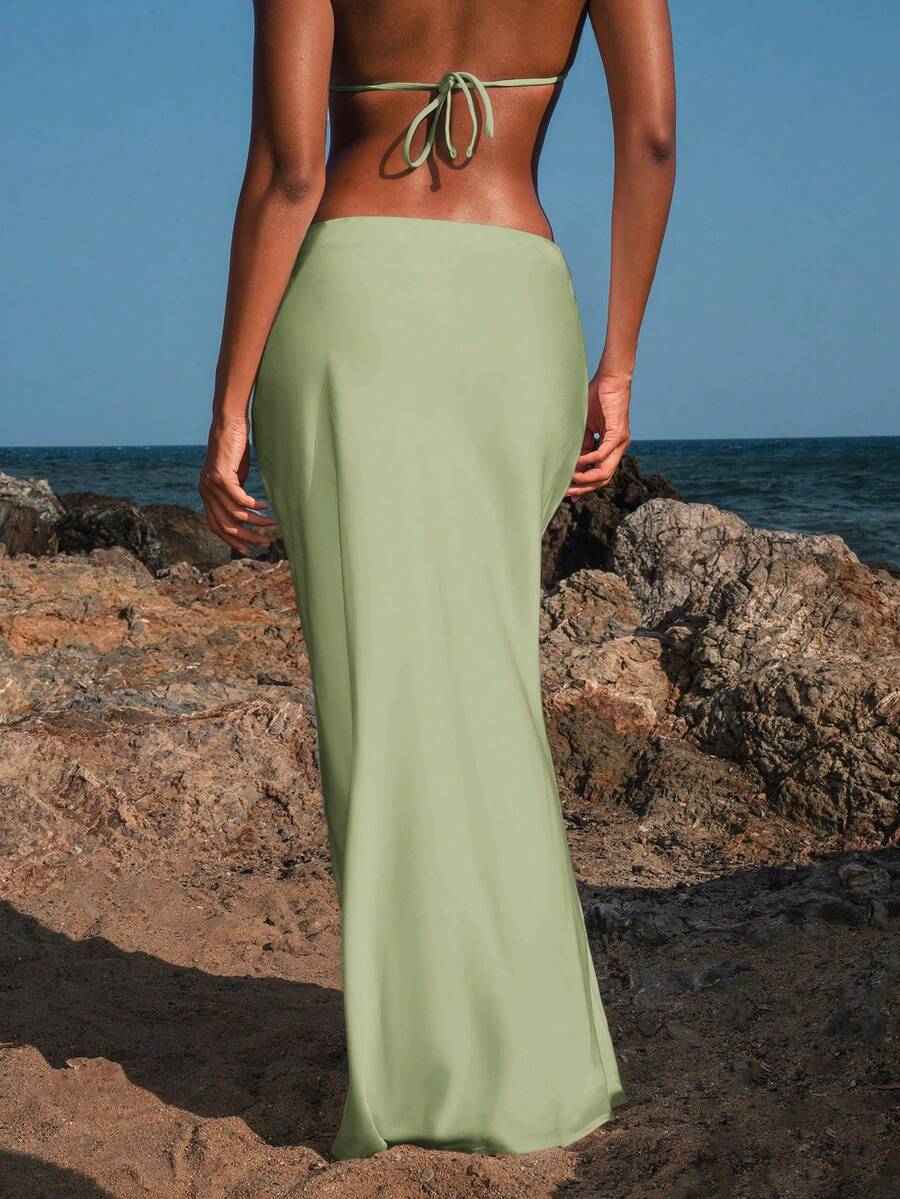 Women's black woven mermaid maxi skirt featuring a solid color design, mid waist, and 100% cotton fabric.