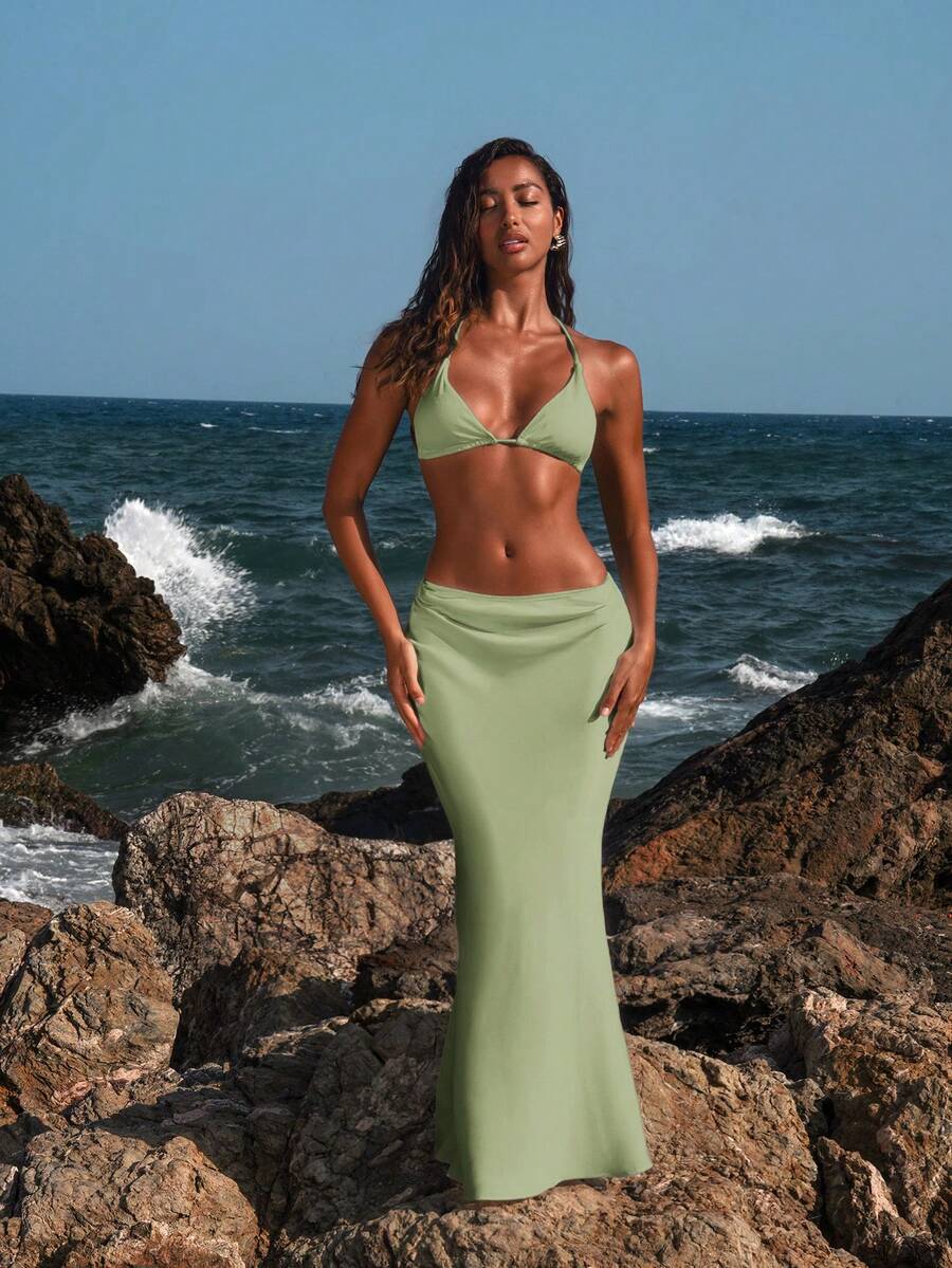 Women's black woven mermaid maxi skirt featuring a solid color design, mid waist, and 100% cotton fabric.