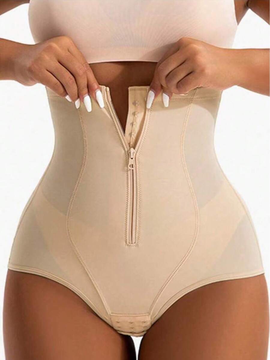 Women's black super high waist shaping pants with zipper closure, strong tummy control, and butt lifting feature.