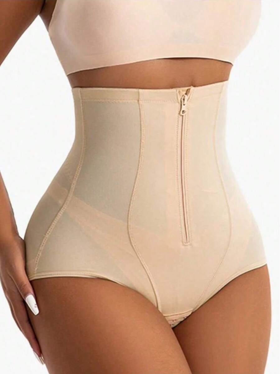 Women's black super high waist shaping pants with zipper closure, strong tummy control, and butt lifting feature.