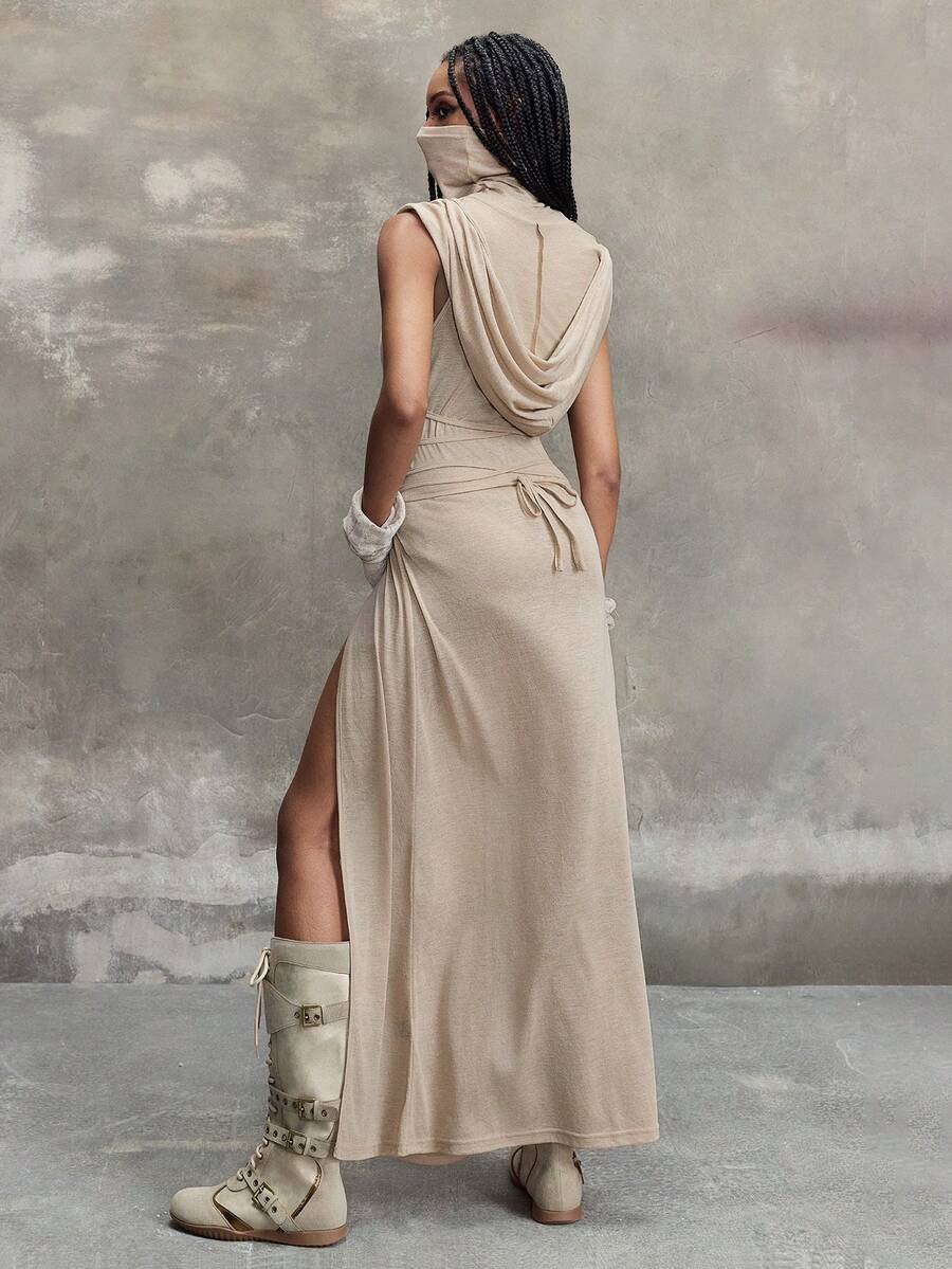 Women wearing a Y2K vintage apocalyptic style hooded long dress featuring short sleeves, backless detail, high thigh slit, and slim fit knitted fabric.