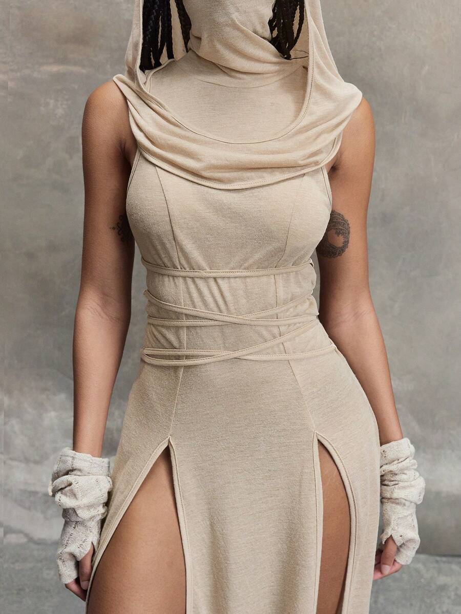 Women wearing a Y2K vintage apocalyptic style hooded long dress featuring short sleeves, backless detail, high thigh slit, and slim fit knitted fabric.