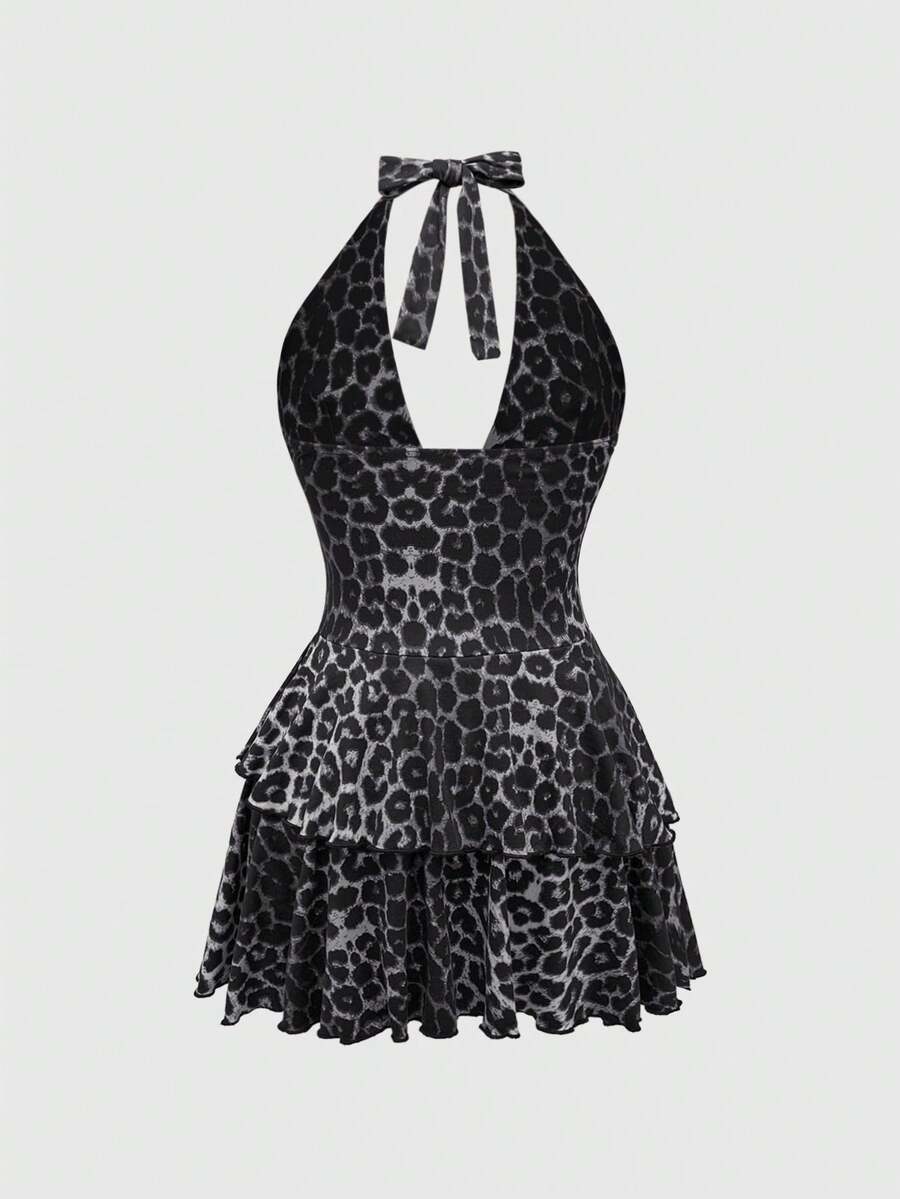 Women's burgundy halter leopard print mini dress featuring a backless cut-out design and tiered layered hem.