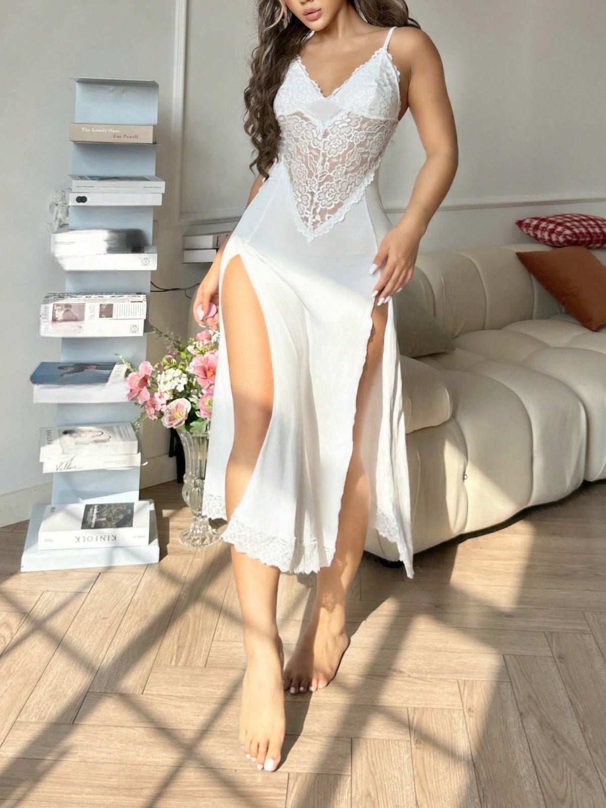 Women's black lace slip nightgown featuring a backless design, contrast lace patchwork, split thigh detail, and spaghetti straps.