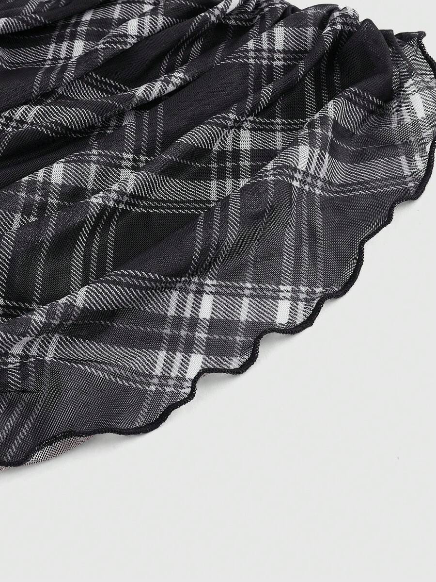 Women's black polka dot strapless tube top made of ruched mesh fabric featuring an asymmetrical hem and matching scarf.